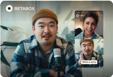 Man wearing a brown beanie sitting in front of a microphone, watching a story of him and woman.